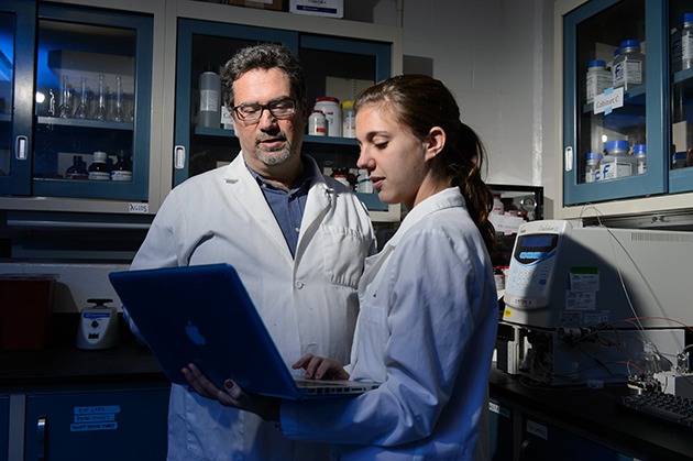 John Salamone, distinguished professor of psychology, in the lab at the Bousfield Building with Samantha Podurgiel, a graduate student, on Jan. 15, 2013. (Peter Morenus/UConn Photo)